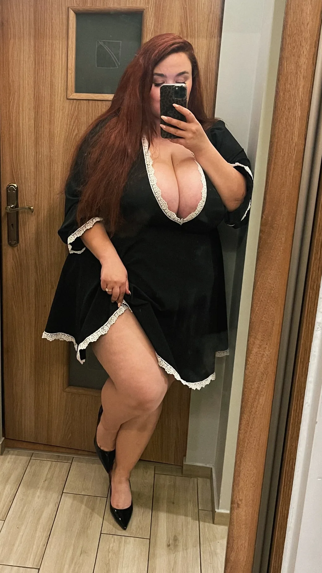 Vanessa wearing a black dress with lace details